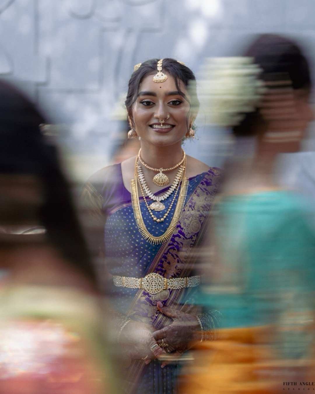 A bride posing in warm courtyard light